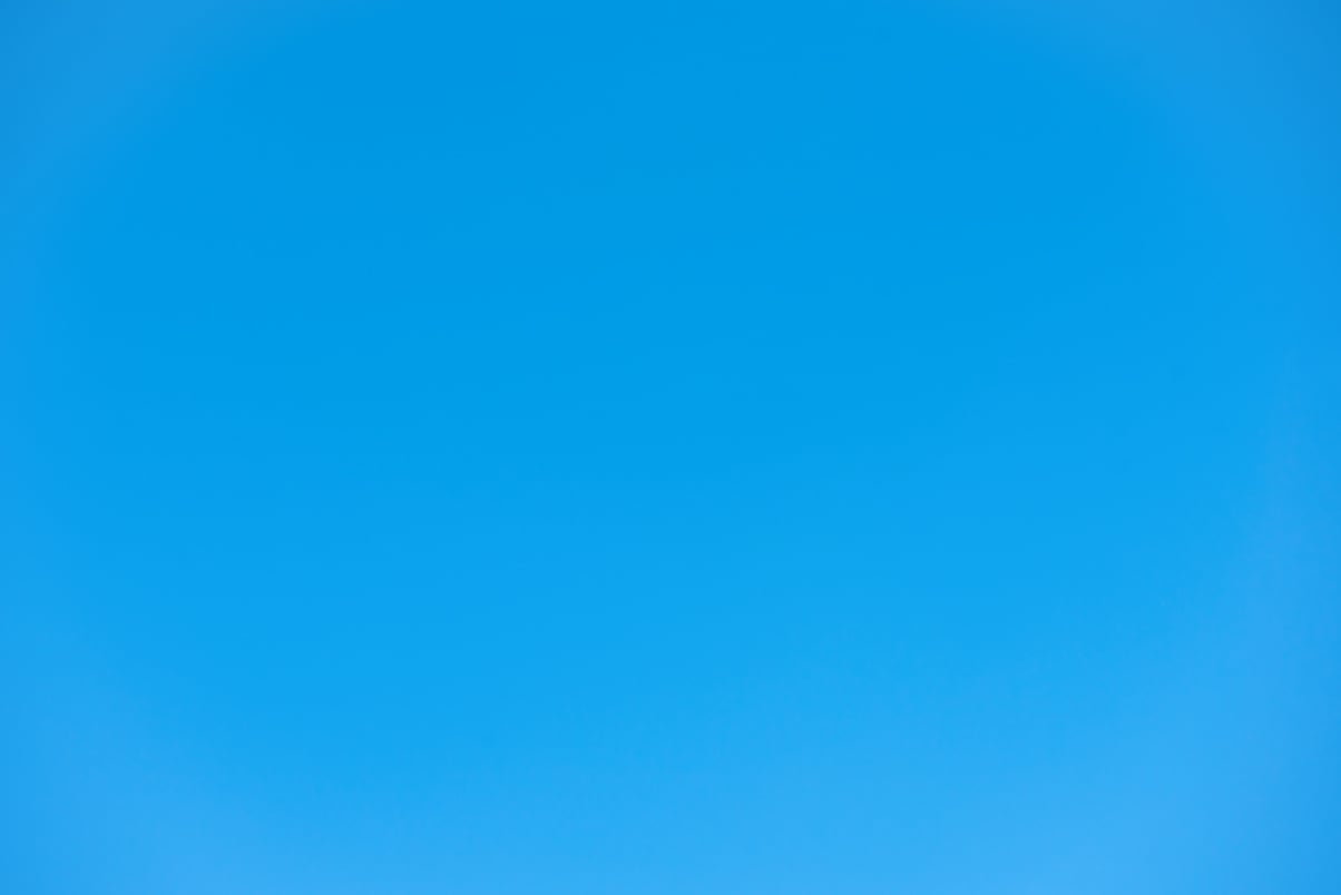 Cloudless clear summer light blue sky for background